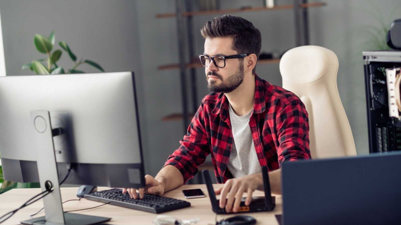 10 Secrets To Negotiating a Higher Salary Man working in desktop computer