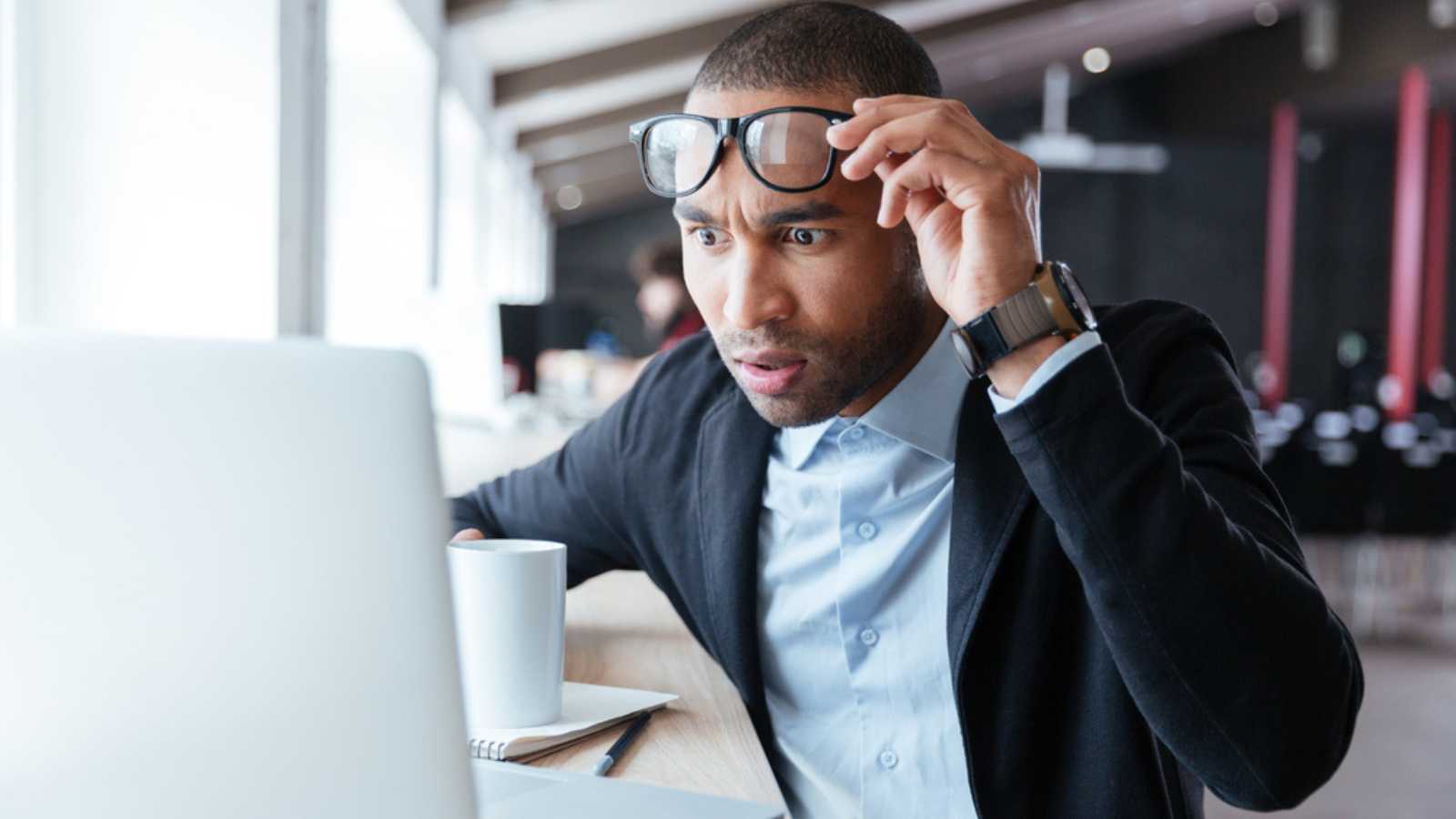 10 Secrets To Negotiating a Higher Salary Working man shocked seeing mail